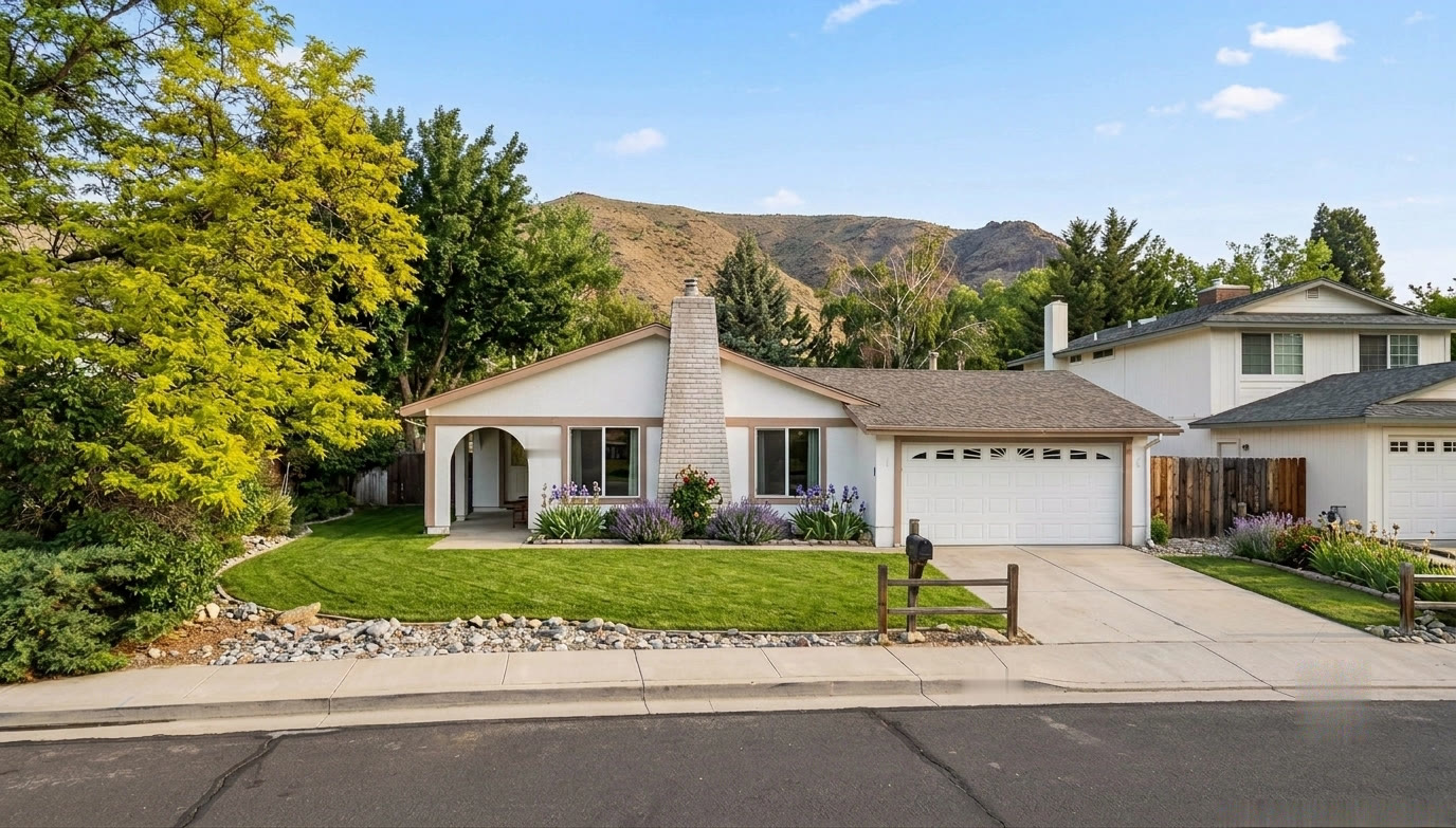 Single-story ranch home with hills behind in southeast Reno